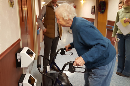 Brevillier resident uses the IRIS retinal identification scanner to open a secure door in Barnabas Court North.