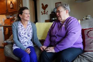 Brevillier Village volunteer and resident talking.