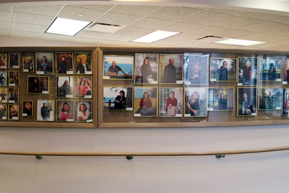 Pictures of past employees on Wall of Fame at Brevillier Village. 